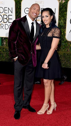 Dwayne "The Rock" Johnson was not on his fashion game that night, wearing a maroon velvet suit that fell short in comparison to his colleagues attire. 