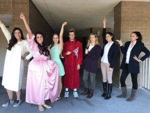 A group of seniors represent New York City by dressings as characters from the Broadway play Hamilton.
