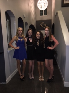 Seniors Sydney Michalek, Melanie Shor, Dana Corredor, and Tiffany Pruss take a picture before heading to the dance.