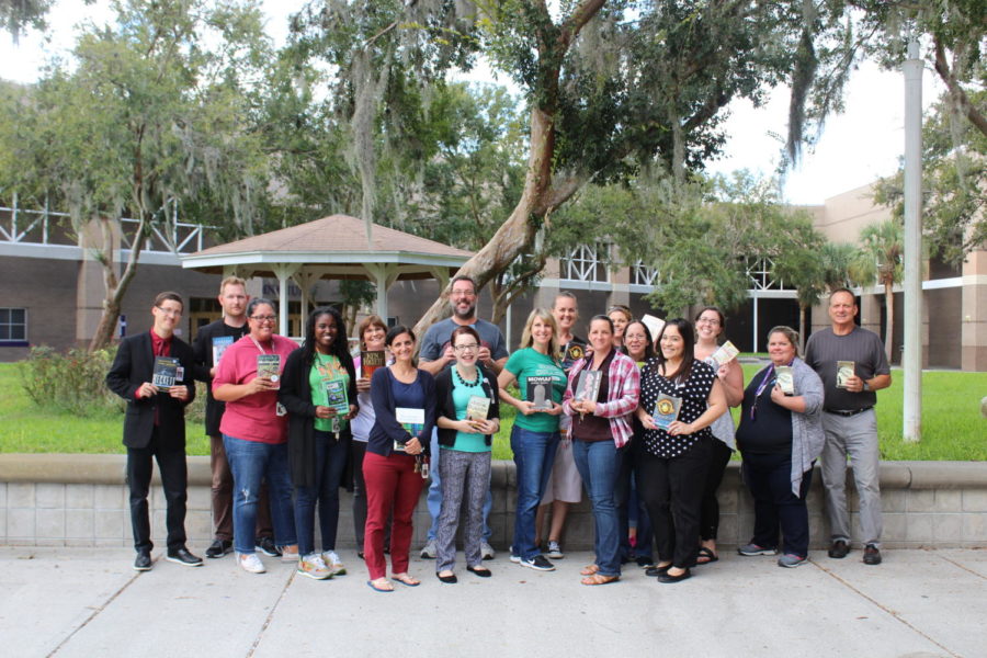 Winter Springs High School English teachers pose with their favorite books.
(Courtesy of WSHS Yearbook)